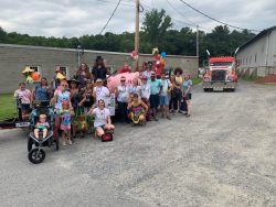 wells river savings bank employees getting ready for a parade